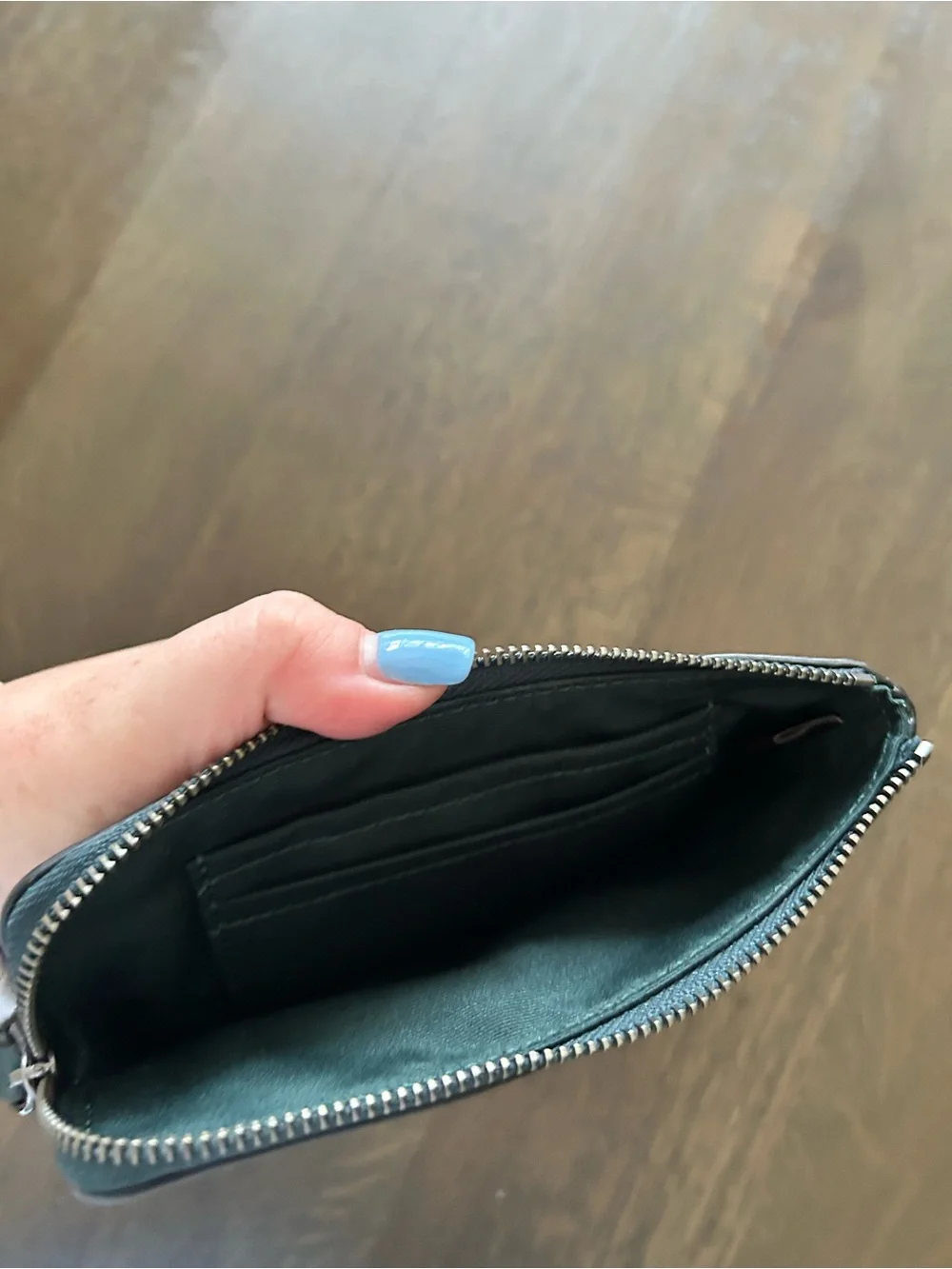 Coach carriage embossed green wristlet leather